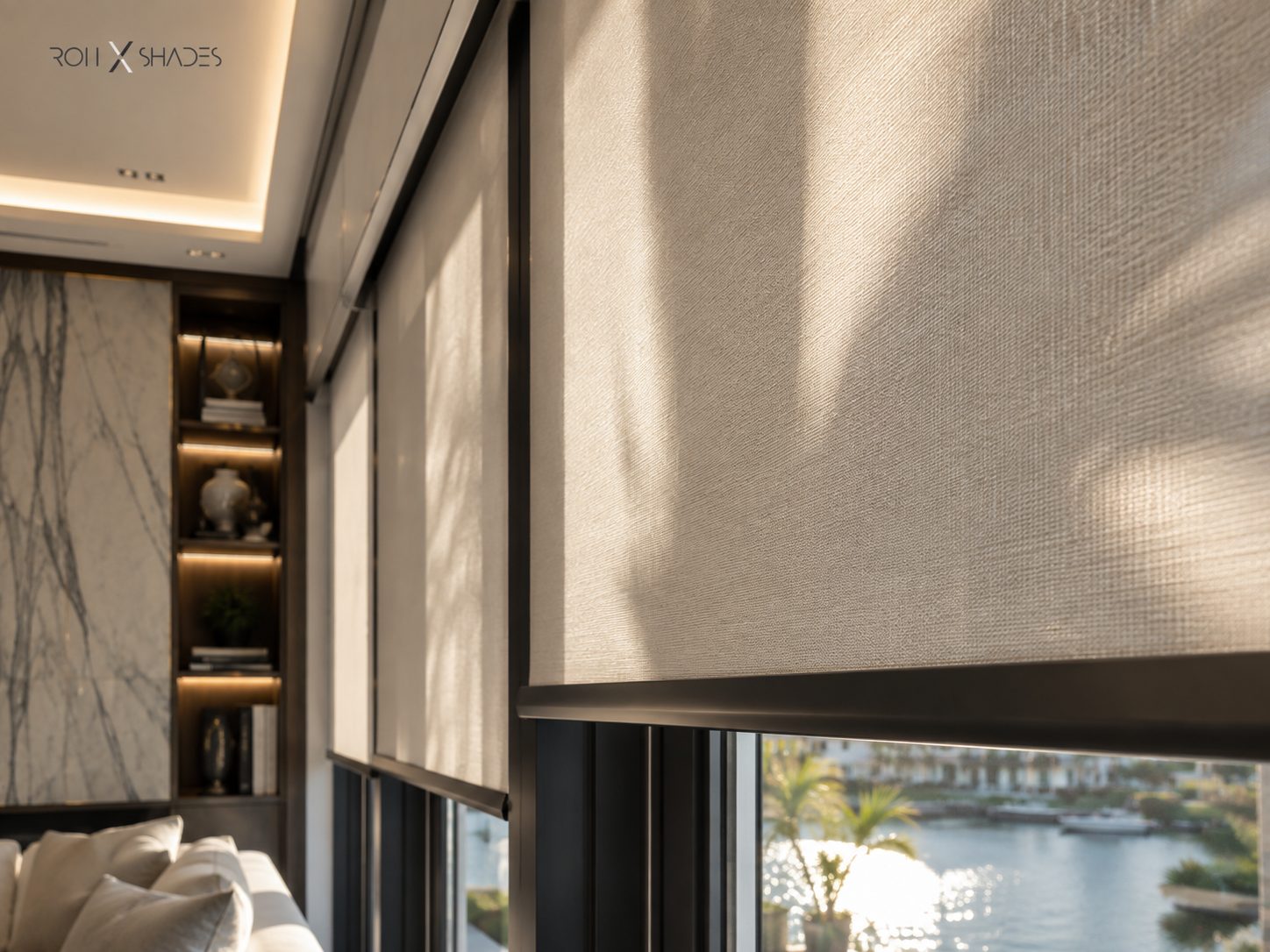 Close view of a woven solar roller shade in warm daylight